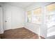 Bright bedroom with wood-like floors and window views at 1913 E Wilder Ave, Tampa, FL 33610