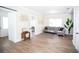 Living area featuring gray sectional sofa and wood-look floors at 1913 E Wilder Ave, Tampa, FL 33610