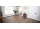 Bright living room with vinyl flooring and sliding barn door at 1913 E Wilder Ave, Tampa, FL 33610