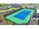 Community tennis court with green and blue surface at 2001 Longliner Loop, Wesley Chapel, FL 33543