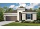 One-story home with brown garage door and shutters at 2061 Longliner Loop, Wesley Chapel, FL 33543