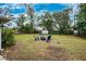 Large backyard with fire pit and plenty of space for outdoor entertaining at 218 W Seneca Ave, Tampa, FL 33612