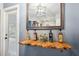 Charming kitchen with a rustic wood shelving unit and four bottles of wine at 218 W Seneca Ave, Tampa, FL 33612