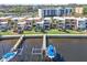 Aerial view of waterfront community with boat slips and lush landscaping at 2424 W Tampa Bay Blvd # C212, Tampa, FL 33607