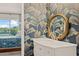 Vanity with marble countertop and palm-leaf patterned wallpaper at 2424 W Tampa Bay Blvd # C212, Tampa, FL 33607