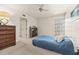 Bedroom with dresser, window and ceiling fan at 2424 W Tampa Bay Blvd # C212, Tampa, FL 33607