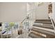 View of a staircase overlooking a living area and balcony at 2424 W Tampa Bay Blvd # C212, Tampa, FL 33607