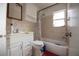 Bathroom with shower/tub combo, white vanity, and tiled walls at 2480 18Th N Ave, St Petersburg, FL 33713