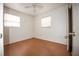 Simple bedroom with light wood flooring and ceiling fan at 2480 18Th N Ave, St Petersburg, FL 33713