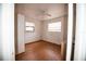 Small bedroom with hardwood floors and two windows at 2480 18Th N Ave, St Petersburg, FL 33713