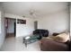 Simple living room with tiled floors, two sofas, and a coffee table at 2480 18Th N Ave, St Petersburg, FL 33713