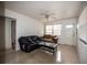 Living room with tiled floors, two sofas, and coffee table; access to other rooms at 2480 18Th N Ave, St Petersburg, FL 33713