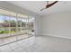 Bright Gathering room with view of pond and screened patio at 2552 Glenrise Pl, Wesley Chapel, FL 33544