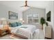 Main bedroom with large window and virtually staged furniture at 2552 Glenrise Pl, Wesley Chapel, FL 33544