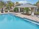 Inviting community pool with plenty of lounge chairs at 2552 Glenrise Pl, Wesley Chapel, FL 33544