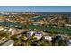 Wide aerial view of a waterfront home and neighborhood at 3118 S Maritana Dr, St Pete Beach, FL 33706