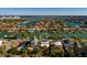 Aerial view of waterfront home with private pool and lush landscaping at 3118 S Maritana Dr, St Pete Beach, FL 33706