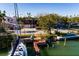 Aerial view of waterfront home with private dock and sailboat at 3118 S Maritana Dr, St Pete Beach, FL 33706