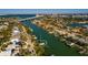 Aerial view of waterfront home and neighborhood at 3118 S Maritana Dr, St Pete Beach, FL 33706