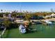 Aerial view of waterfront home, private dock, and sailboat at 3118 S Maritana Dr, St Pete Beach, FL 33706