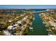 Aerial view of canal front home with private dock at 3118 S Maritana Dr, St Pete Beach, FL 33706