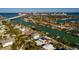 Wide aerial view of a waterfront home and neighborhood at 3118 S Maritana Dr, St Pete Beach, FL 33706