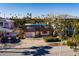 Two-story house with a tarp on the roof, situated on a residential street at 3118 S Maritana Dr, St Pete Beach, FL 33706