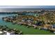 Beachfront home with private pool and lush landscaping; aerial view at 3118 S Maritana Dr, St Pete Beach, FL 33706