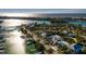 This aerial view showcases a waterfront home near the ocean at 3118 S Maritana Dr, St Pete Beach, FL 33706