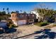 Two-story home with attached garage and mature landscaping at 3118 S Maritana Dr, St Pete Beach, FL 33706