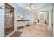 Elegant bathroom with soaking tub, double vanity, and walk-in shower at 335 Bath Club S Blvd, North Redington Beach, FL 33708