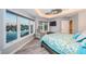 Spacious bedroom with water views and sitting area at 335 Bath Club S Blvd, North Redington Beach, FL 33708