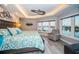 Main bedroom with water views, sitting area, and large bed at 335 Bath Club S Blvd, North Redington Beach, FL 33708