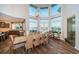 Elegant dining room with water views and large table at 335 Bath Club S Blvd, North Redington Beach, FL 33708