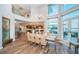 Bright dining room with water views and kitchen access at 335 Bath Club S Blvd, North Redington Beach, FL 33708