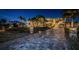 Grand entrance to a luxury home with palm trees at 335 Bath Club S Blvd, North Redington Beach, FL 33708