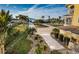 Landscaped walkway leading to a luxurious waterfront home at 335 Bath Club S Blvd, North Redington Beach, FL 33708