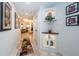 Charming hallway with built-in shelving and tasteful artwork at 335 Bath Club S Blvd, North Redington Beach, FL 33708