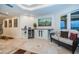 Spacious hallway with built-in wine cooler and seating at 335 Bath Club S Blvd, North Redington Beach, FL 33708