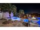 Hot tub and pool area with fire pit and palm trees at 335 Bath Club S Blvd, North Redington Beach, FL 33708