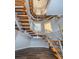 Modern floating staircase with wood and metal accents at 335 Bath Club S Blvd, North Redington Beach, FL 33708