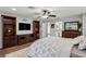 Bright bedroom with built-in shelving, hardwood floors and ceiling fan at 3745 Hillview Ct, Land O Lakes, FL 34639