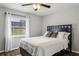 Bedroom with a queen bed, wood floors, and ceiling fan at 3745 Hillview Ct, Land O Lakes, FL 34639