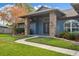 Brick columns and a covered entryway enhance this charming home's curb appeal at 3745 Hillview Ct, Land O Lakes, FL 34639