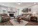 Cozy living room featuring a fireplace and hardwood floors at 3745 Hillview Ct, Land O Lakes, FL 34639