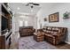 Relaxing living room with leather sofas and a neutral color palette at 3745 Hillview Ct, Land O Lakes, FL 34639