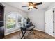 Bright home office with built-in desk and hardwood floors at 3745 Hillview Ct, Land O Lakes, FL 34639