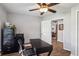 Home office with hardwood floors and view into living area at 3745 Hillview Ct, Land O Lakes, FL 34639