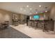 Modern bar area with bar stools and flat-screen TV at 450 Knights Run Ave # 415, Tampa, FL 33602