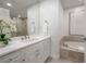 Modern bathroom with marble vanity and soaking tub at 450 Knights Run Ave # 415, Tampa, FL 33602